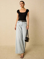 Plain Ribbed Knit Bodysuit Is A Form-Fitting Bodysuit Made Of Ribbed Elastic Material With A Backless Design