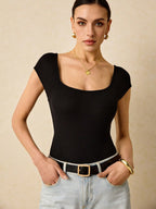 Plain Ribbed Knit Bodysuit Is A Form-Fitting Bodysuit Made Of Ribbed Elastic Material With A Backless Design